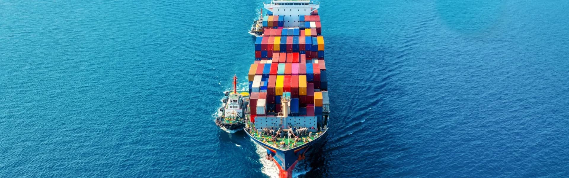 Aerial view of a loaded container ship on open water